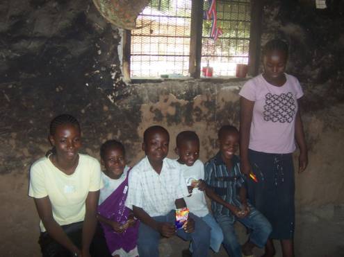 Children of supported family in their house in the Tana River area (fatherless children). Hermann, the boy on the bench's right, received a medical operation in 2009 financed by our society.