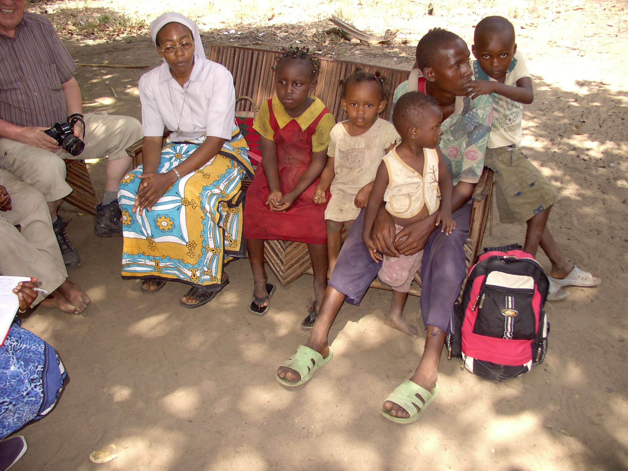 Nurse and one of our members during a meeting with an AIDS orphan group in Baharini, Kenya.